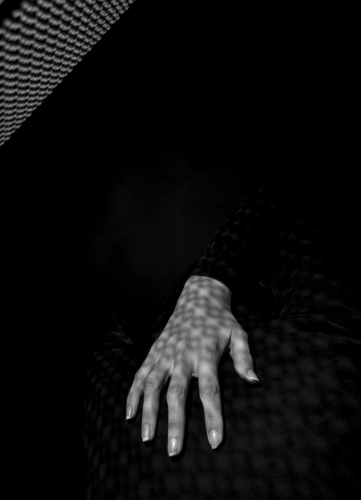 Woman's hand in light & shadow